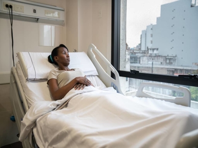 a woman in a hospital bed